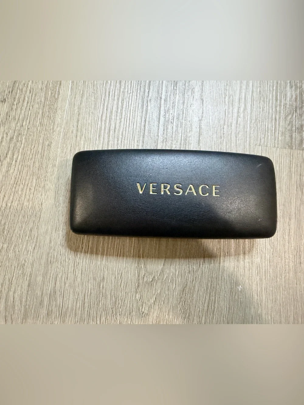 Versace Black Case with Gold Lettering